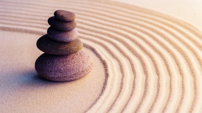 Meditation zen garden with stones on sand